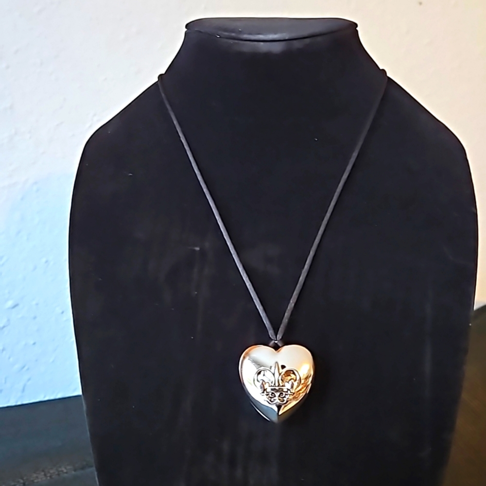 Heart-shaped pendant on black satin cord 36".